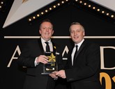 Mercedes-Benz Cars UK head of fleet Rob East (left) collects the award from Elliot Scott, fleet director of Thrifty Car & Van Rental