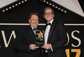 Transport minister John Hayes CBE hands the award to BMW Group general manager, corporate sales Steve Oliver