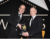 Martin Gurney, PSA Group director – fleet and used vehicles (left), is presented with the award by Elliot Scott, fleet director, Thrifty Car & Van Rental