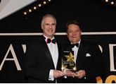 Hyundai national fleet sales manager Paul Williams (left) receives the award from UK transport minister John Hayes CBE