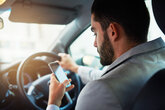 Man on mobile phone while driving