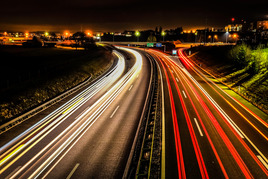 Traffic travelling along a motorway at night