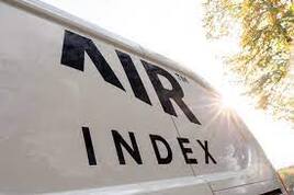 AIR Index decal on the side of a white van