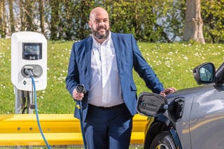 Ford's Neil Wilson putting an EV on charge