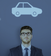 Suited man with car image above his head