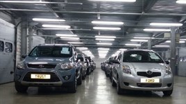 A picture of cars going to auction. 