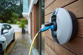 Pod point wall charge plugged into a car