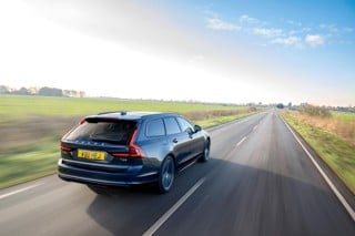 Volvo V90 driving away