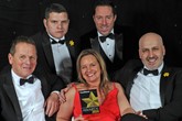 Louise Baker celebrates the Fleet Dealer of the Year award with members of the team 