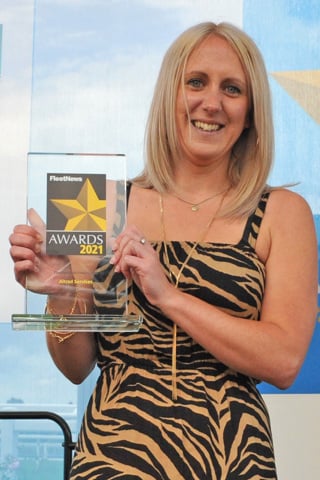 Sarah Turner receives the trophy from award sponsors Free2Move Lease