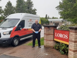 Autoglass van and driver delivering face masks