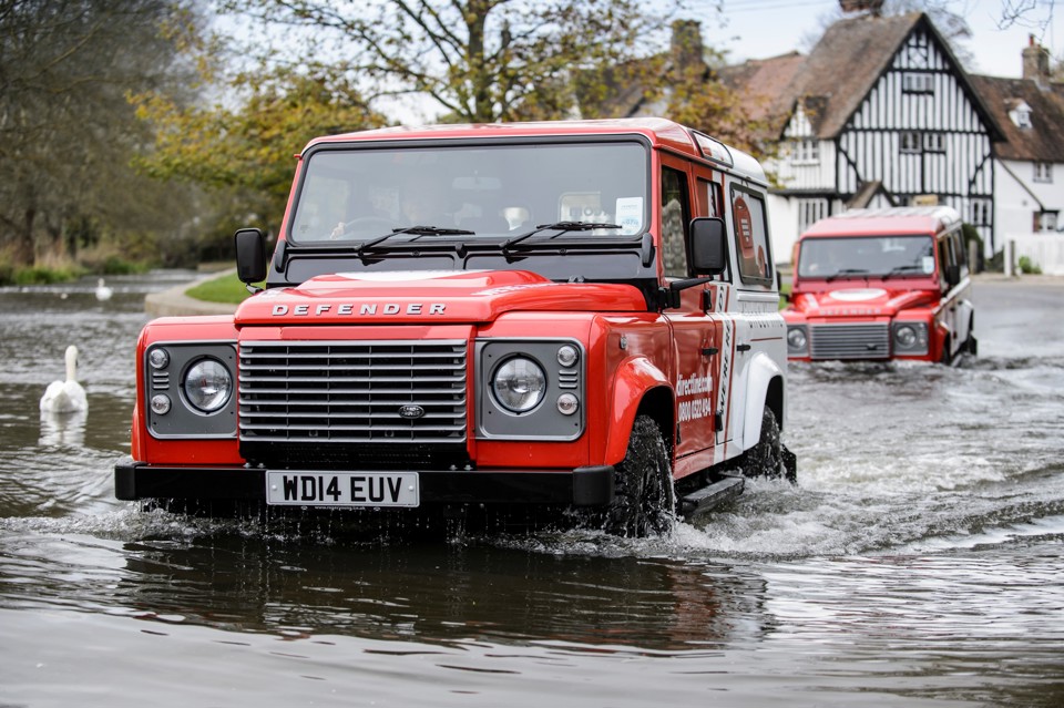 Direct Line Defender crossing a ford