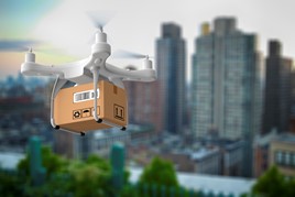 drone carrying a parcel above a city landscape