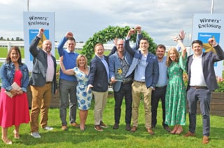 All smiles from Ben Creswick (holding trophy) and his team as they celebrate their Fleet News Awards triumph