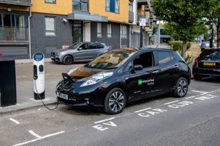 Enterprise Car Club electric car being charged.