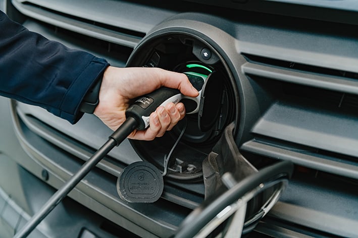 A van using an electric charger