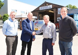 Ian Hughes (centre right) and his son, Simon (right) with Ian Pugh of Fix Auto UK and Head of Franchisee Development Mark Hutchins (left). 