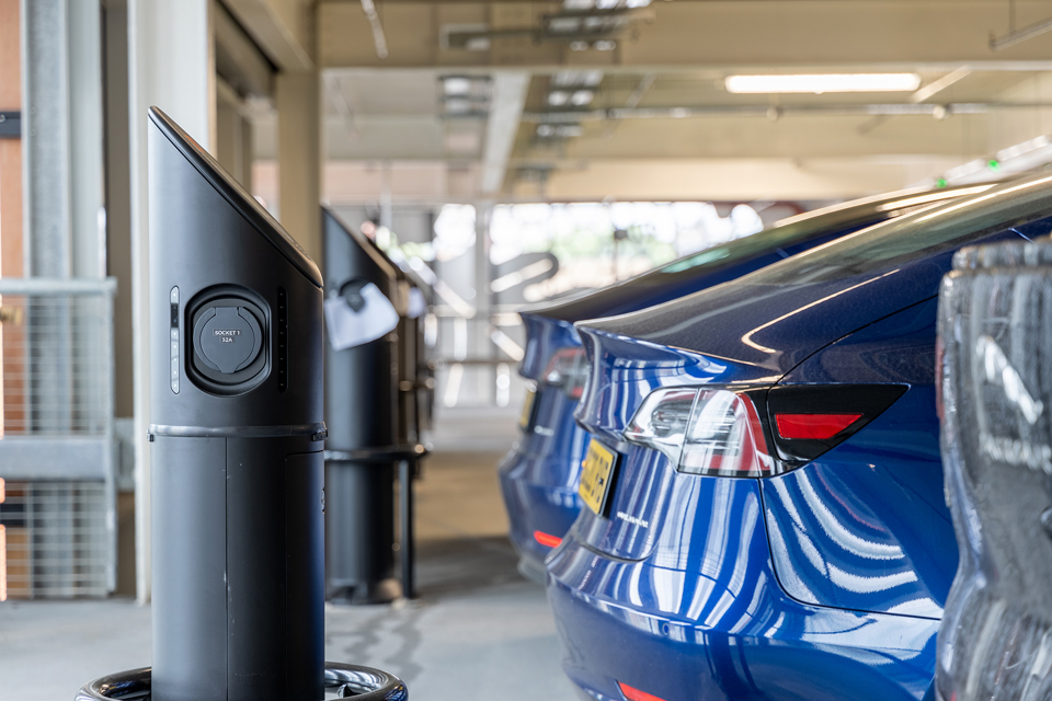 Electric vehicle plugged into charge point