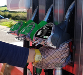 GripHero hand protection being worn to refuel car at forecourt pump