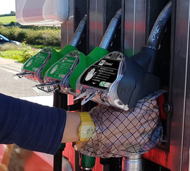 GripHero hand protection being worn to refuel car at forecourt pump