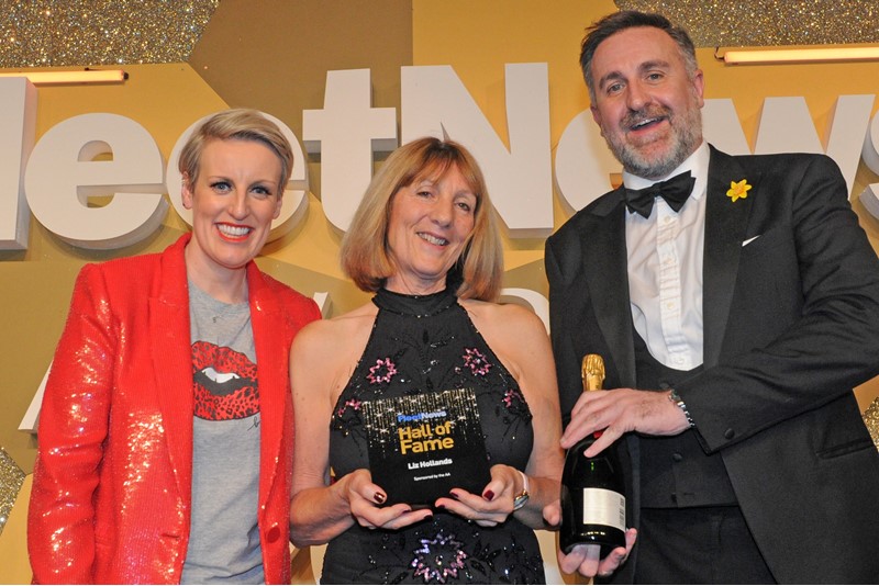 Liz Hollands (centre), of Logistics UK, collected the Hall of Fame trophy from Stuart Thomas, director of business services, Fleet & SME Services at sponsors The AA, while awards host Steph McGovern looks on