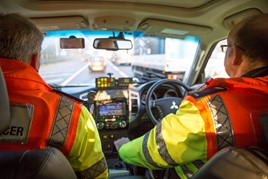 Two Highways England traffic patrol officers in their vehicle 