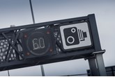 Speed camera sign on motorway gantry