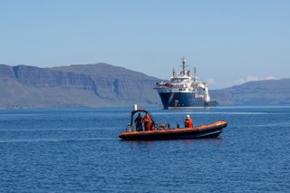 NLB boat with larger boat in the background