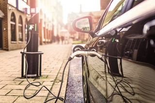 Car plugged into electric vehicle charger