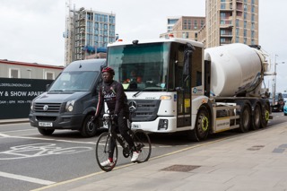 Cyclist, van and truck at London junction 