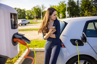 Woman charging an EV