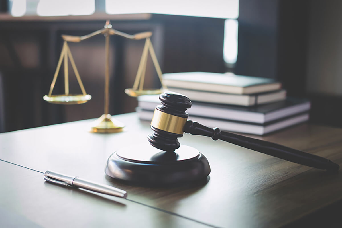 Auctioneers gavel and scales of justice, traffic commissioner