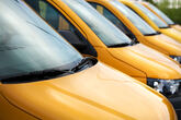 row of yellow vans