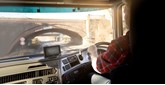 driver in cab of truck