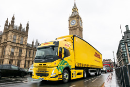 DHL Volvo FM electric on road outside Houses of Parliament
