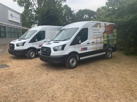 Two vans supplied by Holman parked 