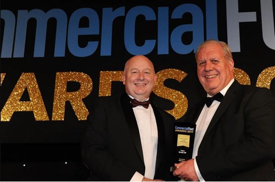 Mark Bobbins, head of commercial operations, WMS Group UK (left) hands the award to Graham Tucker, key accounts manager, Iveco