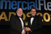 Mark Bobbins, head of commercial operations at WMS Group UK (left) hands the award to Ian Grant, fleet sales director, DAF Trucks