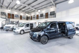 Mercedes-Benz commercial vehicles in a showroom