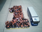 Aerial shot of production staff and first Tevva electric truck